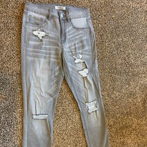 Grey distressed skinny jeans